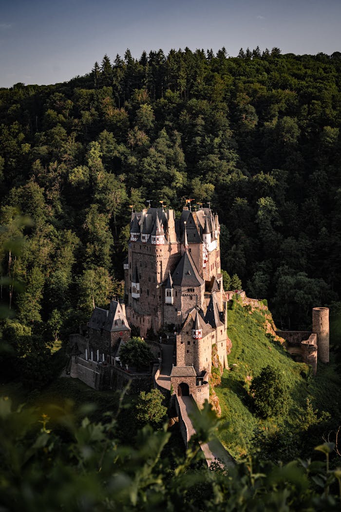 Discover the majestic Eltz Castle nestled in verdant forest, epitomizing medieval architecture and scenic beauty.